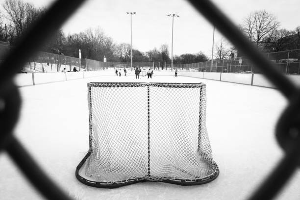 アイスアイスホッケー - ice skating outdoors playful playing ストックフォトと画像