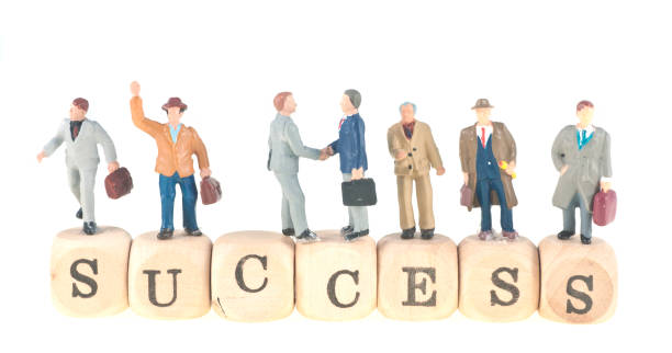 istock success word with businesspeople abstract 155279489