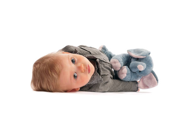 istock Cute baby Isolated on white with stuffed animal 155279755
