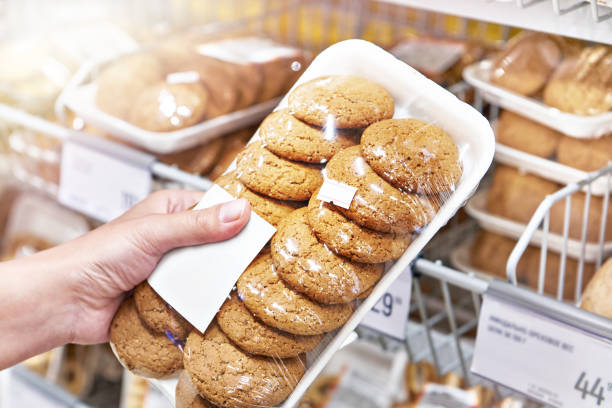 istock Packets of oatmeal cookies in hand 1552798182