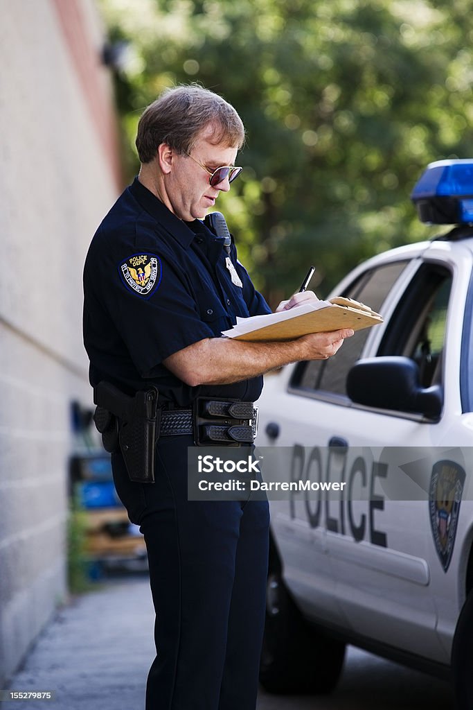 Indagine di polizia - Foto stock royalty-free di 50-54 anni