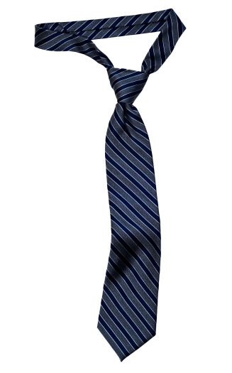 Classic stripped necktie with a Windsor knot and the typical dimple below the knot.