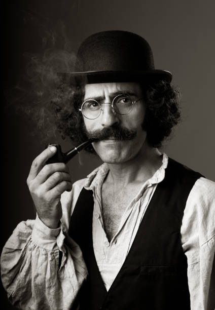 istock Portrait of philosopher in 1800s costume with mustache smoking 155279978