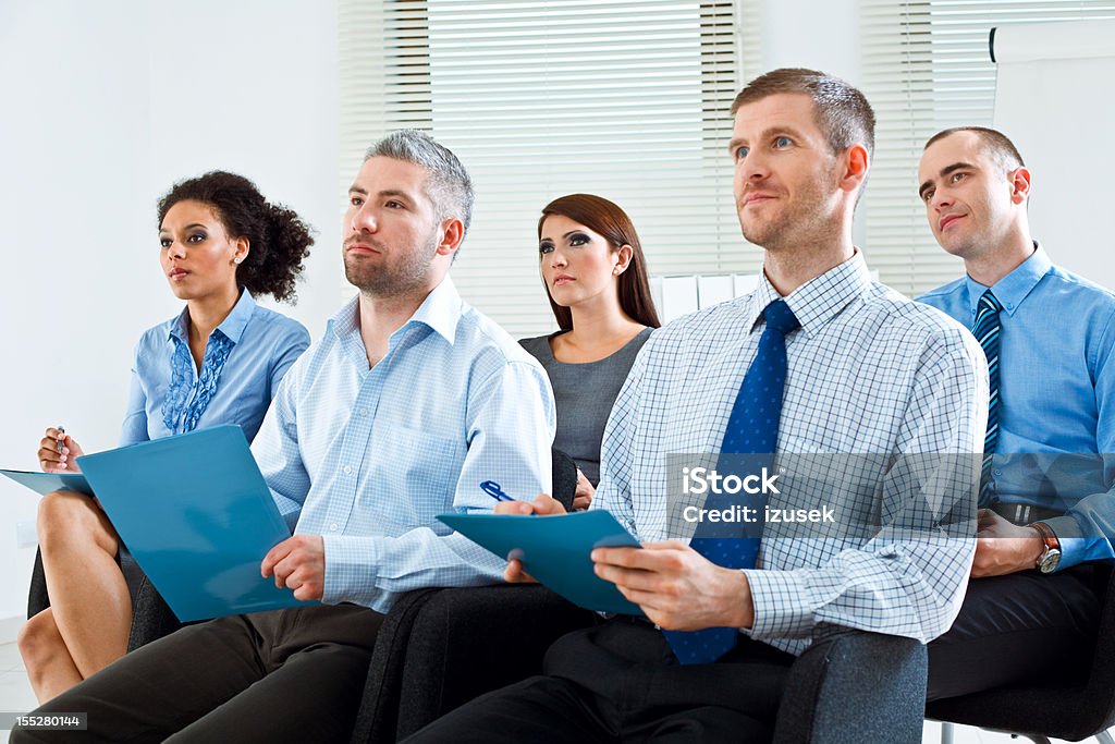 Business seminar Group of business people during business seminar, listening to presentation. Education Training Class Stock Photo