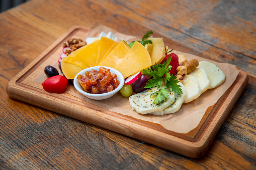 Marble cheese  triangle over wooden background