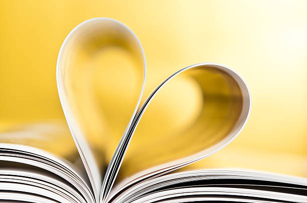 Love to reading books, pages folded into a heart shape stock photo