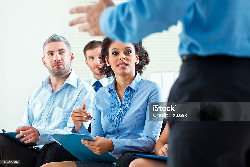 Business seminar Group of business people during business seminar, listening to presentation. 30-34 Years Stock Photo
