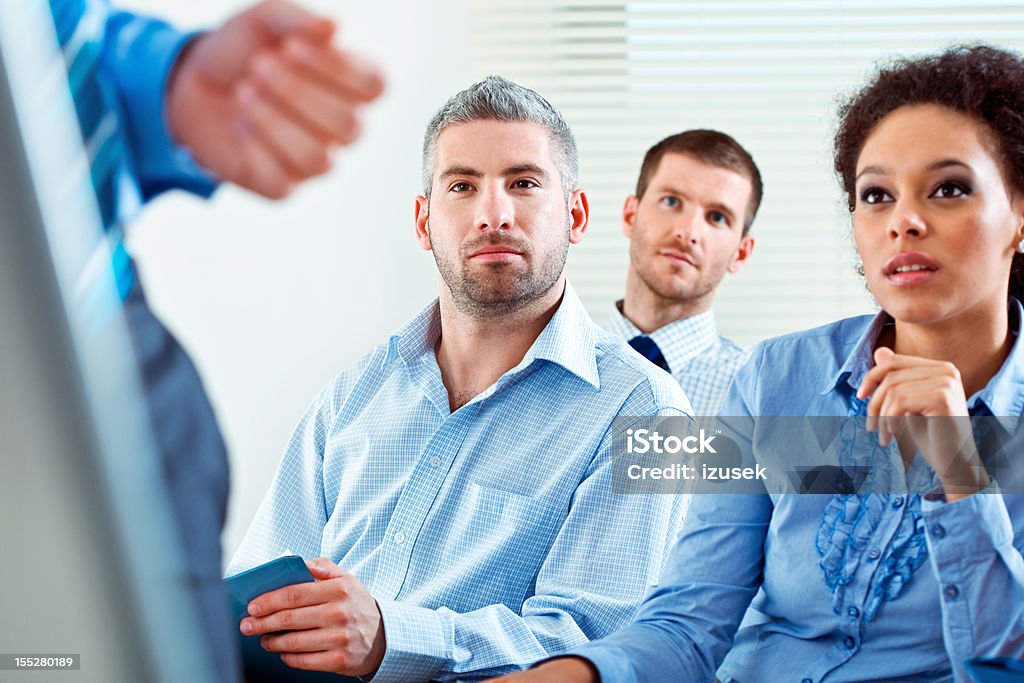Business training Group of business people during business seminar, listening to presentation. 30-34 Years Stock Photo