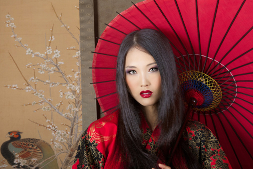 beautiful Japanese woman is dressed red kimono Tokyo - Japan