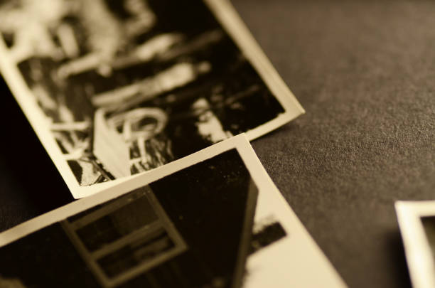 istock Closeup of three B&W photos on gray felt background. 155280562