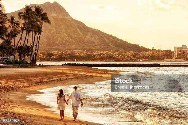 Happy Couple Walking On Waikiki Beach At Sunrise Stock Photo - Download Image Now - Big Island - Hawaii Islands, Hawaii Islands, Beach