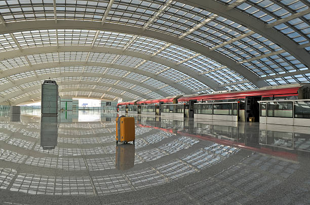 istock Lonely Suitcase and Red Train in Beijing Airport 155280996