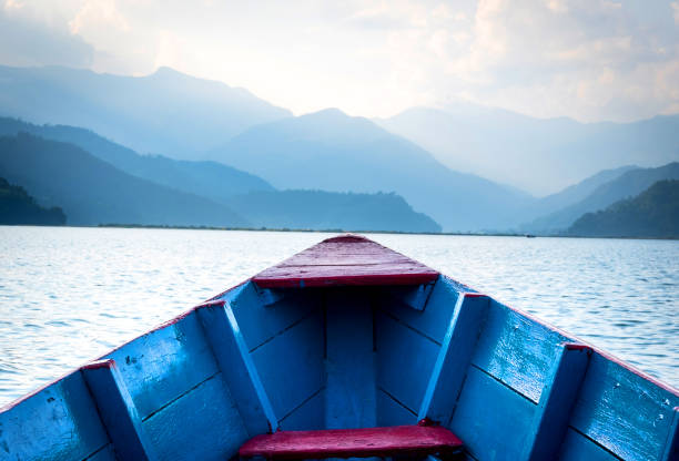 istock Ship nose front view on water and mountains, Pokhara 1552818557