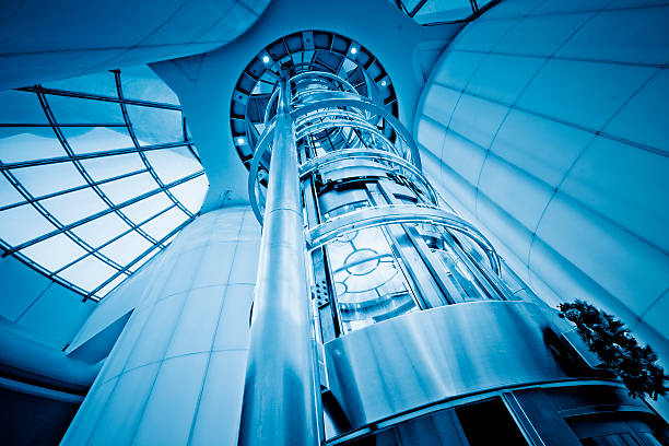 futuristic elevator http://farm9.staticflickr.com/8125/8659505173_b0341b5425.jpg construction skyscraper machine industry stock pictures, royalty-free photos & images