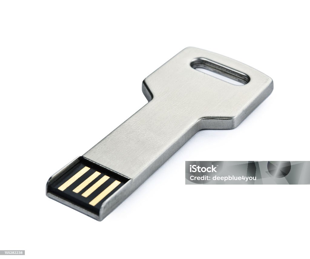 USB flash storage metal key on white macro usb stick in form as a security key on white Key Stock Photo
