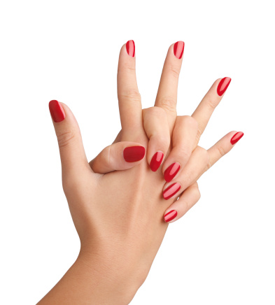 Manicured fingernails painted in red over white background (+Clipping path)