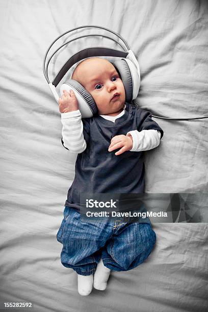 Baby With Headphones Stock Photo - Download Image Now - Baby - Human Age, Headphones, Listening