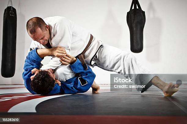 Two Men In Jiujitsu Training Stock Photo - Download Image Now - Jujitsu, Martial Arts, Combat Sport