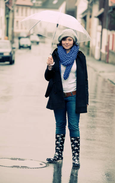 istock Woman with umbrella 155282631