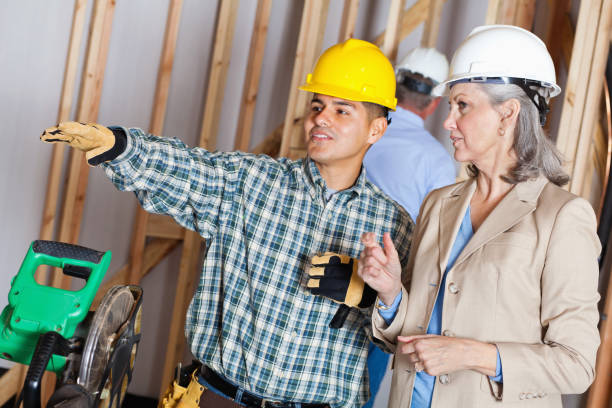 istock Contractor and manager discussing new home build construction 155282708