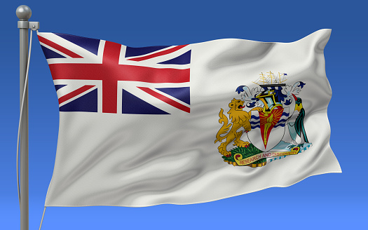 British Antarctic Territory flag waving on the flagpole on a sky background
