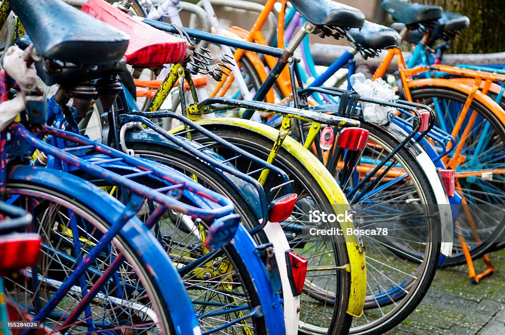 Bicycles in Amsterdam Group of bicycles parked next to Amsterdam Central railway station Amsterdam, Netherlands. Bicycle Rack Stock Photo
