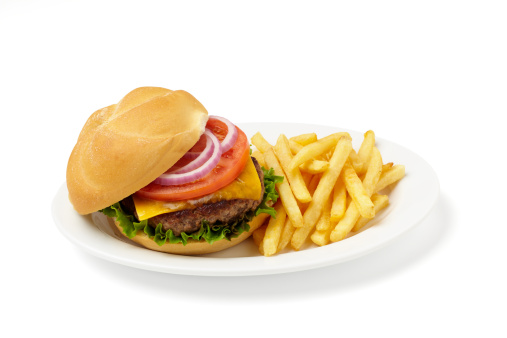 Delicious grilled homemade hamburger with beef, tomatoes, cheese, and lettuce on white background