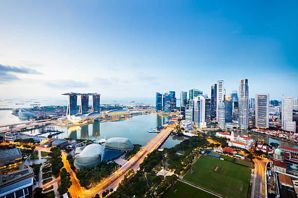 Central Business District, Singapore City The Central Business District in Singapore City at twilight. singapore city stock pictures, royalty-free photos & images
