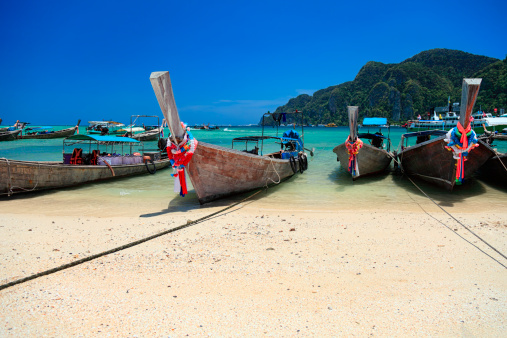 Long tail wooden boats on the beach-Phi Phi Islands-Thailand