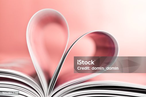 istock Love to read, pages folded into heart shape, pink background 155284336