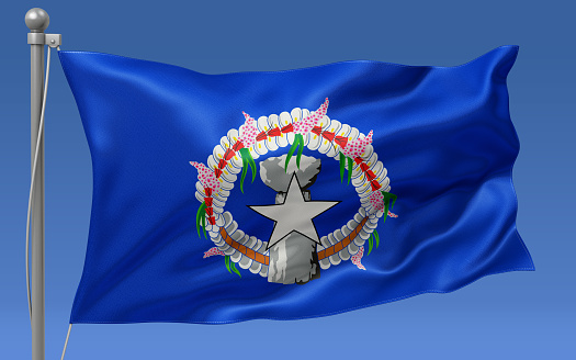 Northern Mariana Islands flag waving on the flagpole on a sky background
