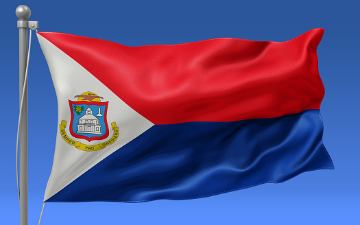 Sint Maarten flag waving on the flagpole on a sky background