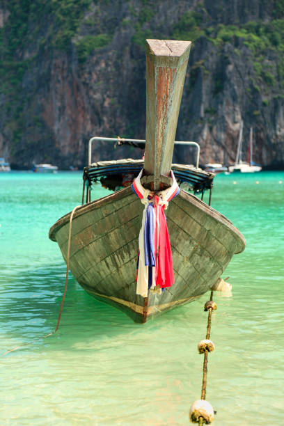 Long tail wooden boat moored at Maya Bay-Phi Phi Islands-Thailand