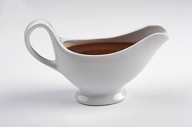 istock White china gravy boat isolated on white background. 155284624