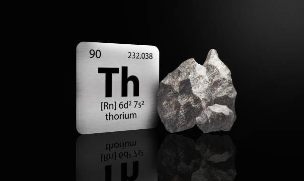 istock Thorium elements on a metal periodic table with greyish black metamictic Thorium on dark background. 3D rendered icon and illustration. 1552846722