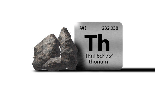 istock Thorium elements on a metal periodic table with greyish black metamictic Thorium on white background. 3D rendered icon and illustration. 1552846729