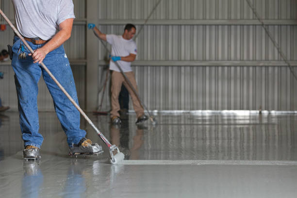 istock Painters Apply Epoxy Paint to an Airport Hanger 155284704
