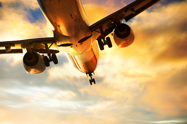 istock Airplane landing in the eveing 155284816