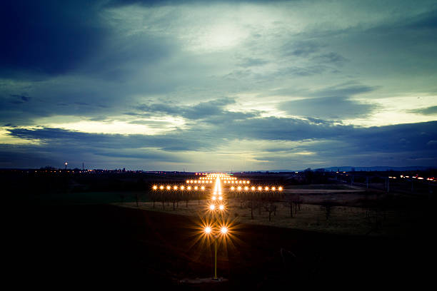 View on navigation lights at dusk View on navigation lights at dusk airfield stock pictures, royalty-free photos & images