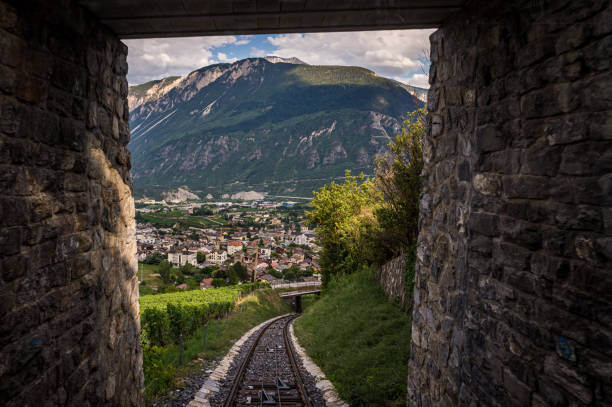 Tunnels and railways. Light on the end of the tunnel. Tunnels and railways. Light on the end of the tunnel. Crans Montana, Valais Canton, Switzerland. crans montana stock pictures, royalty-free photos & images