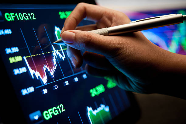 istock Person analyzing the market trends on a digital screen 155285319