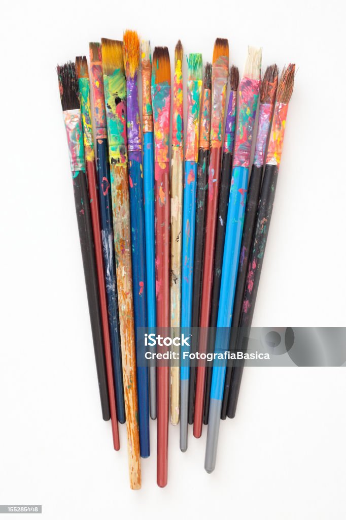 Used paintbrushes Several dirty brushes over white background Paintbrush Stock Photo