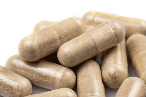 istock Vitamin C capsules on a white background. macro photography. 1552855367