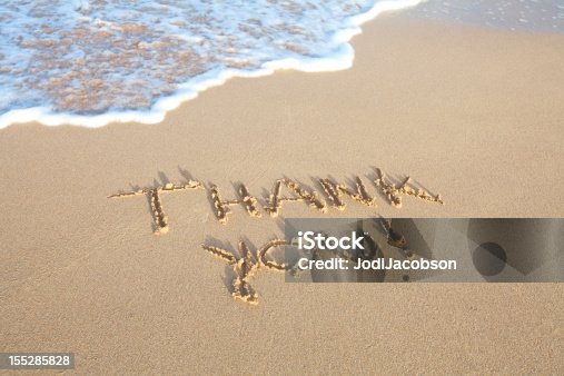istock Thank you written in Sand on the beach 155285828