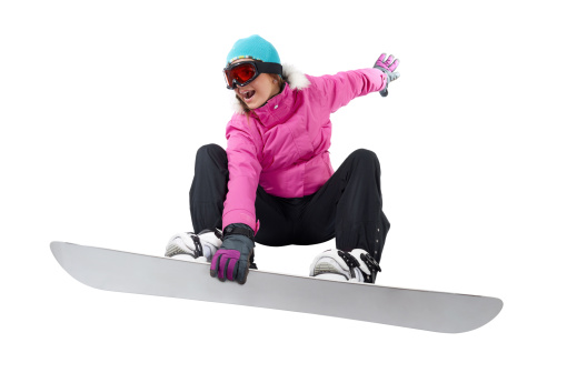 Girl in pink and black clothes snowboarding. Shot in studio on white background,, with a clipping path