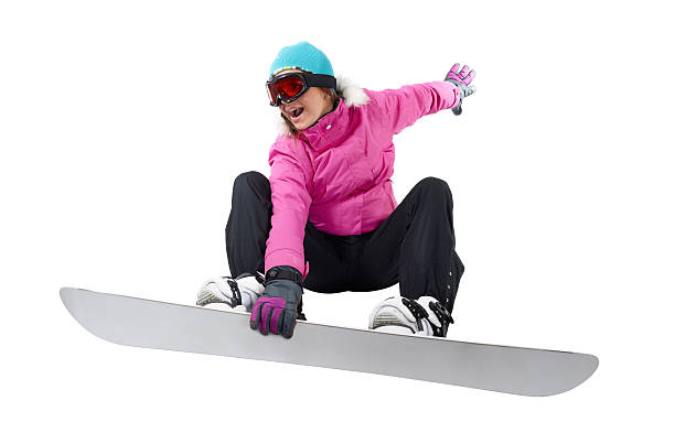 Snowboarding girl with a clipping path Girl in pink and black clothes snowboarding. Shot in studio on white background,, with a clipping path snowboarder stock pictures, royalty-free photos & images