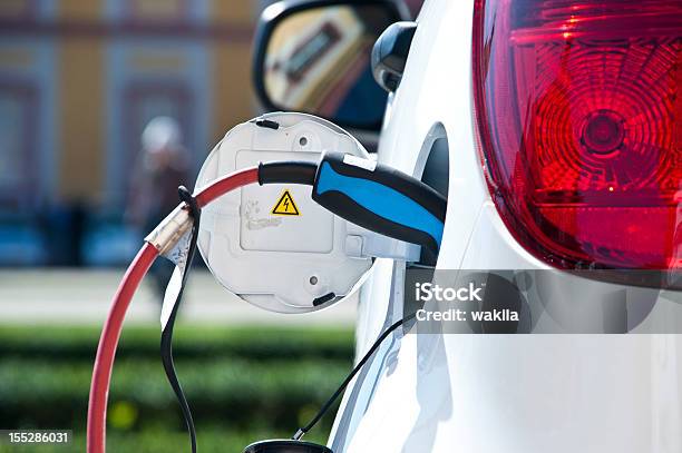 Charge White Electric Car Stock Photo - Download Image Now - Electric Car, Charging, Electric Vehicle