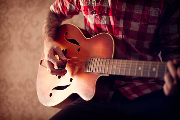 Playing a Guitar stock photo