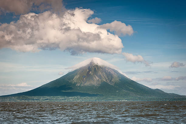 Budget travel concept, RV vacations on the lakeshore, volcano view