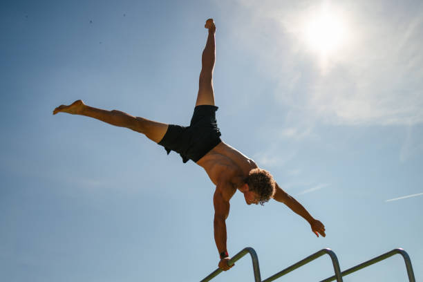 istock Strong young sportsman doing calisthenics 1552861342